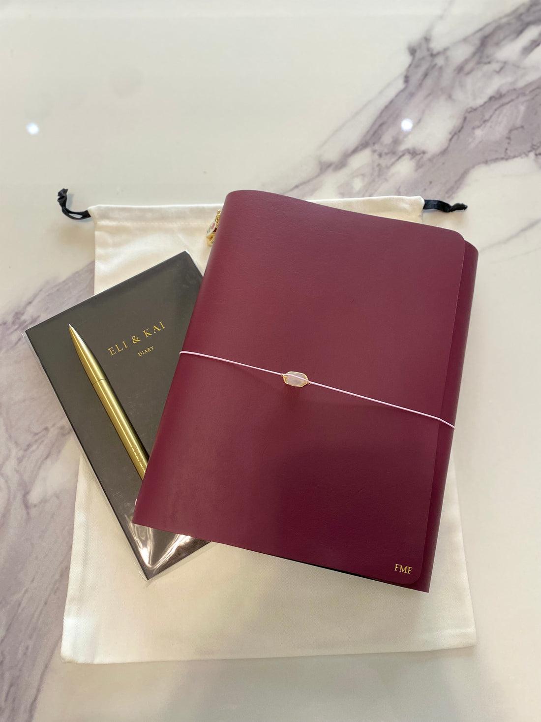 Oxford large leather journal held in hand in light pink leather