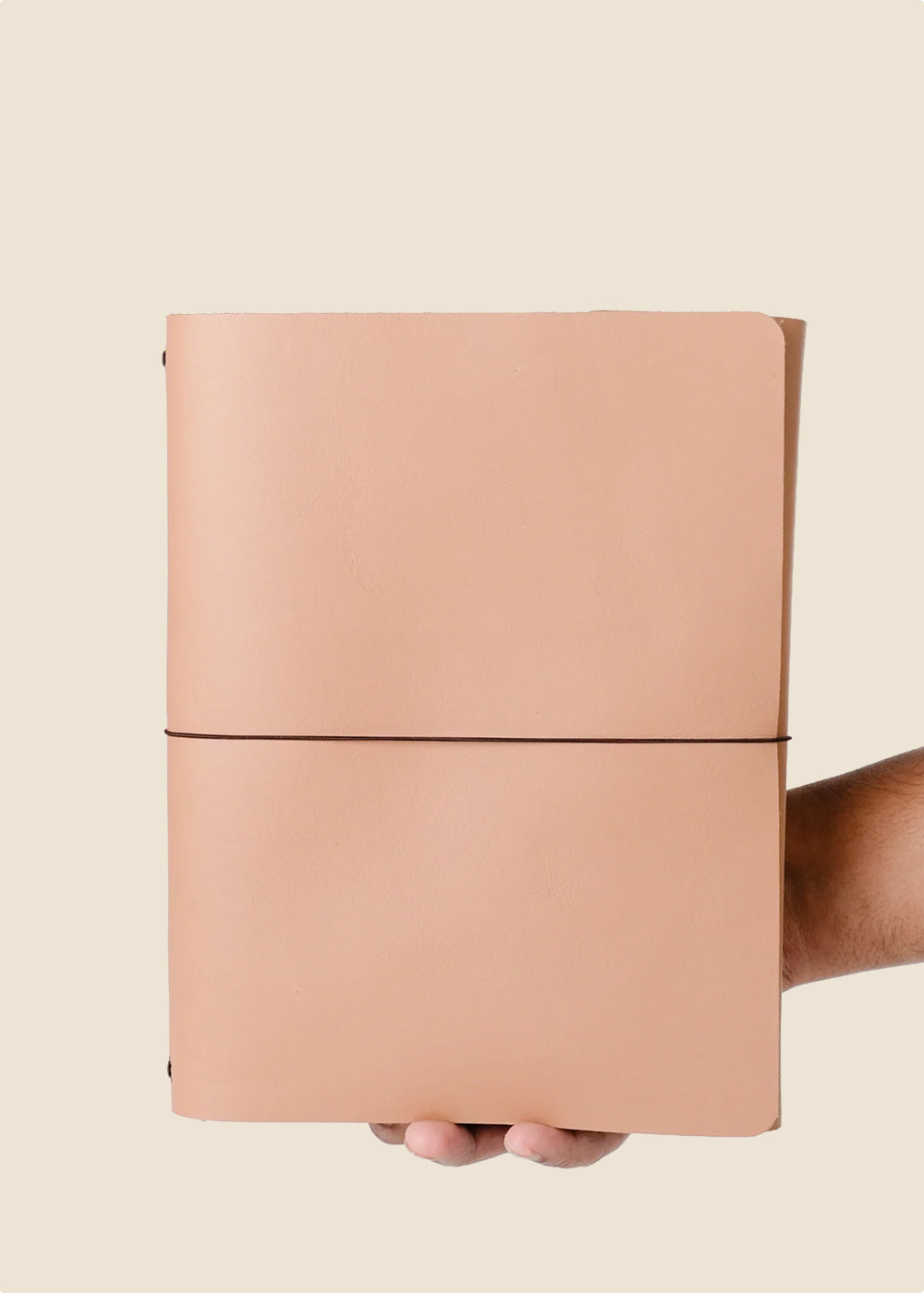 Oxford large leather journal held in hand in light pink leather