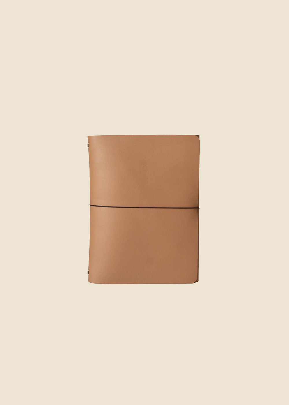 Heatherfield A6 leather journal held in hand in black leather